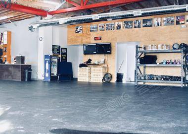 Industrial open gym space with floor to ceiling windows